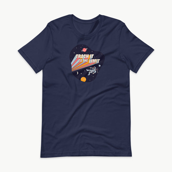 An illustration of an astronaut with a trach and tubing floating in outer space surrounded by stars and planets. Behind the astronaut, bold retro text reads “Trach It to the Limit,” with colorful light trails shooting from the words like a rocket launch. The design appears on a dark background. It is on a navy blue adult t-shirt.