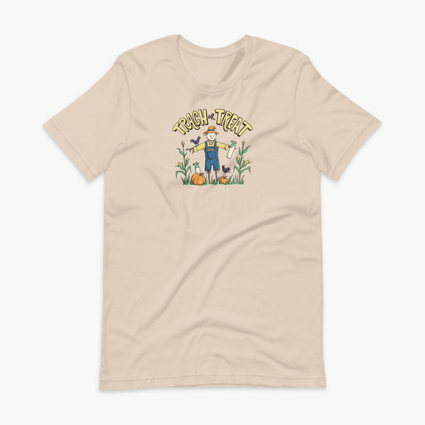 Trach or Treat Halloween tracheostomy t-shirt in soft cream, scarecrow with oxygen tanks, adult unisex tee by StomaStoma