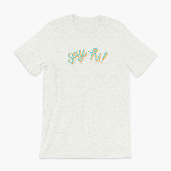 Floating say hi! script text on an ash adult t-shirt